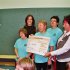 Katarina Witt / Bild: Scheckübergabe bei einem Charityprojekt der Katarina Witt Stiftung